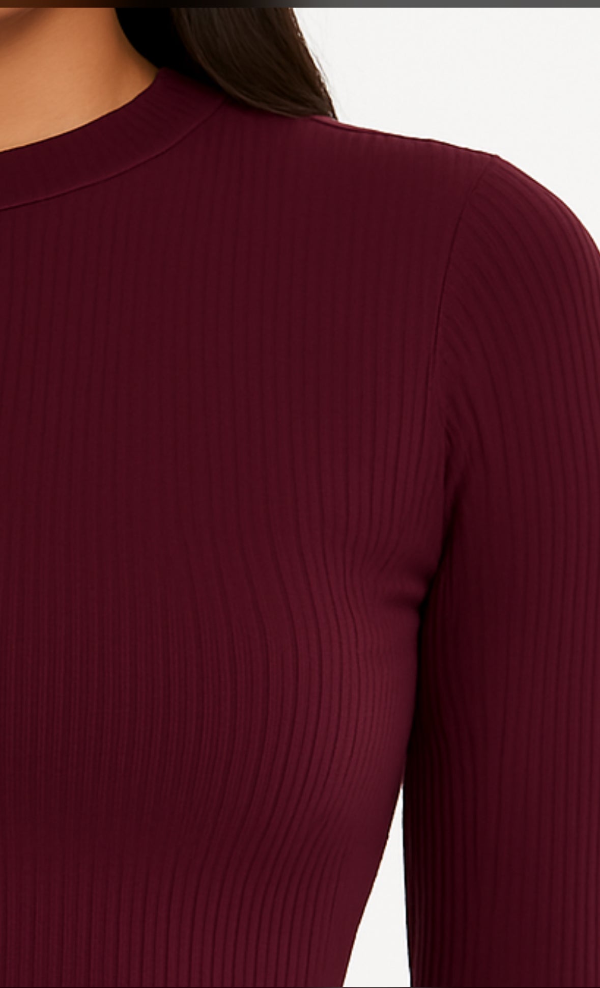 Woman wearing ribbed mock neck long sleeve top and matching leggings set in neutral color