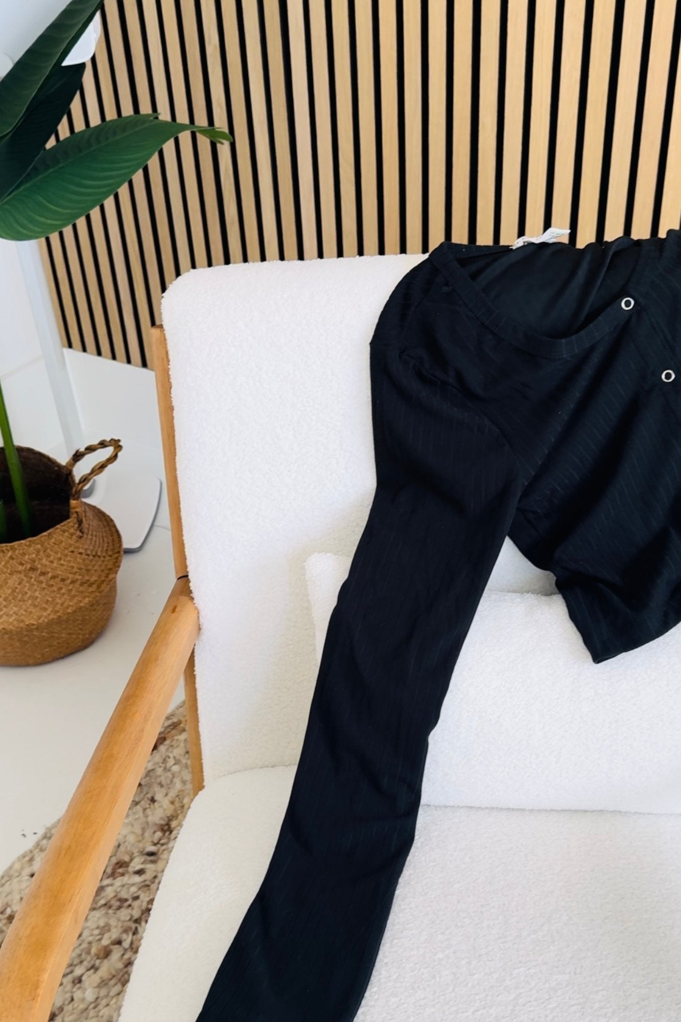 Woman wearing a button-down crop top with short sleeves and a fitted silhouette. Soft and stretchy fabric makes this top perfect for layering, casual outings, or elevated everyday looks.